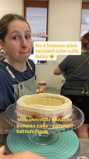 Banana miso caramel cake! Banana cake filled with layers of milk chocolate ganache, dark chocolate brownie, and miso caramel ganache. Wrapped in a caramel buttercream with drips of miso caramel, caramel sauce and brownie pieces | The Cake Eating Company