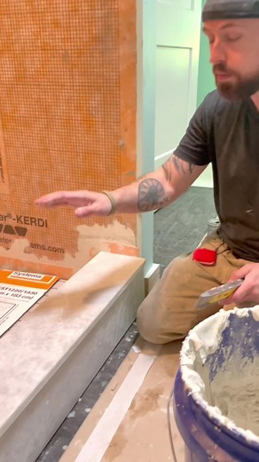 How to install a solid marble shower curb to allow for proper drainage. #tile #tileinstallation #shower #tileshower #showercurb | Seth Riley