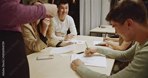 Students, alongside their professor, engage in drawing and painting in a modern classroom setting, learning techniques and collaborating as they sketch and create art together.