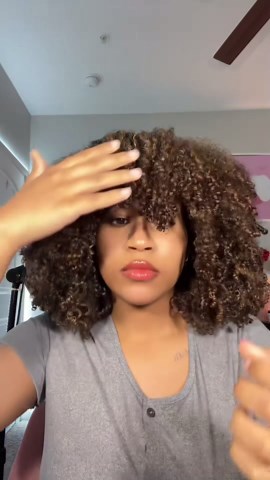 Easy hair hack for overgrown curly bangs