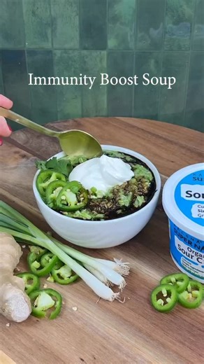 Kalona SuperNatural: #AlmostRaw Organic Dairy from Small Farms on Instagram: "Immunity Boost Soup 💚🥣 w/ Kalona SuperNatural Organic Sour Cream Recipe inspo @wishbonekitchen Ingredients * 4 cups chicken broth * 1 heaping cup cooked rice * 1 cup cooked and pulled chicken * 4 medium cloves of garlic * 2 inches fresh ginger, peeled * 2 stalks of green garlic, or scallions or green onions, white and green parts * 3 jalapeños, stems and seeds removed, plus more for garnish * 1 cup cilantro, packed p