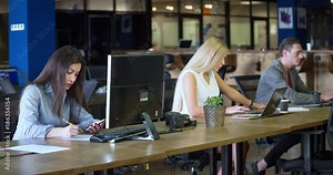 Group of people working over computer screen in office 4k video. Business team at workplaces. Company staff in open space