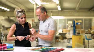 professional fashion designer choosing the right pantone colour for trend clothing production in textile industry