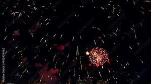 Night Sky Fireworks Display: A breathtaking display of fireworks illuminates the night sky, creating a mesmerizing spectacle of light and color. The vibrant bursts paint the darkness with streaks of r