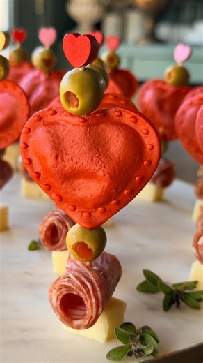 Valentine’s Day Antipasto Skewers ❤️❤️❤️ These easy Valentine antipasto skewers are layered with heart-shaped ravioli, green olives, folded heart salami roses, and a white cheddar cheese cube for the perfect bite. I like setting them out with a little olive oil and balsamic glaze on the side so everyone can dip as they go. Simple, festive, and so easy! If you’re looking for Valentine’s Day appetizer ideas, or an easy party food that feels special, these work for date night at home, Galentine’s g