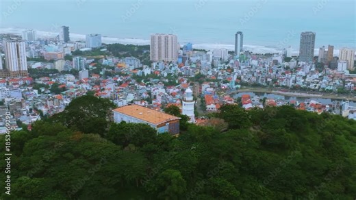4K Aerial Panorama of Vung Tau City and Coastline from Vung Tau Lighthouse the panoramic view of Vung Tau City, Vietnam, as seen from the Vung Tau Lighthouse on Small Mountain (Nui Nho)