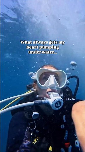 female scuba diver excited underwater