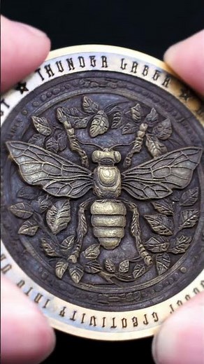 Intricate 3D embossing on brass coins made by Aurora Lite #thunderlaser