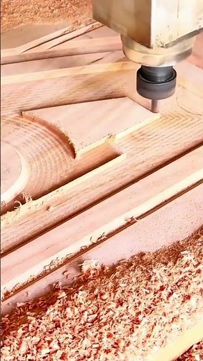 process of using a CNC router to precisely cut and engrave complex patterns into a wooden board