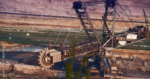 Giant Brown Coal Mine with Bucket Wheel Excavator. Shoot on Digital Cinema Camera in 4k - ProRes 422 codec