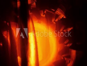 Inside of rotary burning kiln or furnace. Industrial production process of cement clinker or expanded clay. Clinkers tumble in cooling device.