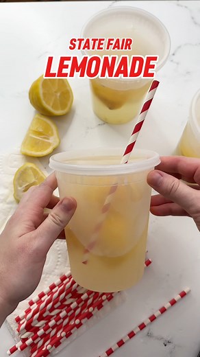 STATE FAIR LEMONADE 🍋🥤 Sometimes called a lemon shake-up, this refreshing drink is much more concentrated than everyday lemonade because you're using less water AND full lemon slices (including the peel!) to get that zesty flavor you know and love! When you shake everything up, you're left with a chilled blend of lemony goodness that'll give you nostalgia in every sip. It's the ultimate summer drink! https://www.designeatrepeat.com/state-fair-lemonade/ #designeatrepeat #fairfood #statefair #fr