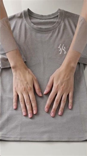 Demonstrate how to fold a T-shirt in 10 seconds #Shorts