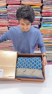 Meenakari Blue Bandhej x Zardosi Moti Sequin Embroidery. It's one of one. Handmade from scratch. Woven in the holy city of Varanasi and then travels to the villages of Kutch for the rai bandhej. It then comes to our karkhans for the solid Zardosi embroidery. Fall in love with the heirloom. Available on www.mahavirs.com in Bandhej Section. Or drop us a WhatsApp on 91 8369591691 #Saree #Sarees #SareesUSA #SareeUSA #SareesCanada #HandloomSaree #BandhejSaree #BandhejSarees #BlueSaree #SareeLove #Sar