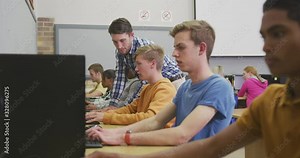 Students working on computers in high school class