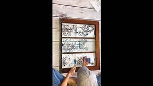 She's using elmers glue & an old window...