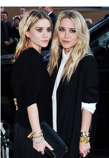 Mary-Kate and Ashley Olsen's style is a mix of boho-chic and understated luxury, defined by an oversized silhouette, vintage finds, and a curated mix of high-end and low-end pieces. Key elements include large sunglasses, layered and voluminous clothing like slouchy sweaters and coats, statement jewelry, and an overall effortless and refined aesthetic. Their signature look has evolved to become a refined version of their earlier, more bohemian styles. #olsentwins #olsensisters #therow