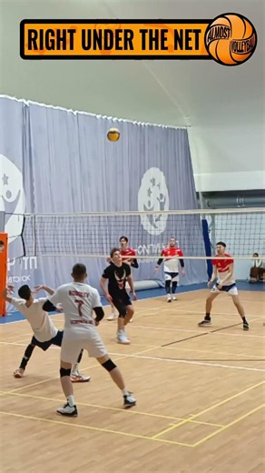 OPPOSITE HITTER BLOCKS BALL IN AMATEUR VOLLEYBALL MATCH