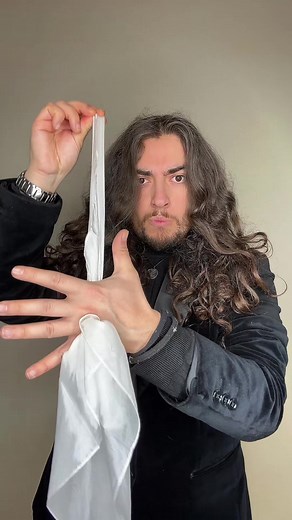 Mastering Illusions: Hand Tricks with a White Cloth