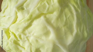 A macro video showcasing the vibrant colors and intricate details of a green cabbage, captured with a probe lens. Explore its crisp leaves, layered structure, and the mesmerizing patterns. 4K