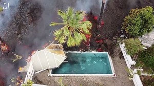 Unstoppable wall of lava meets swimming pool