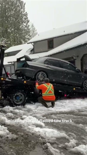unloading car off flatbed tow truck #towworldtowing Renton Towing Service (425)679-2500