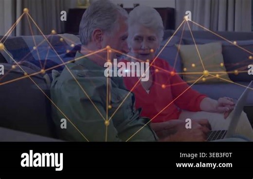 Senior couple leaning in as man typing on laptop activating tech network overlay with blue light. Retirement, connectivity, innovation, collaboration, digital, technology, leisure Stock Video Footage - Alamy