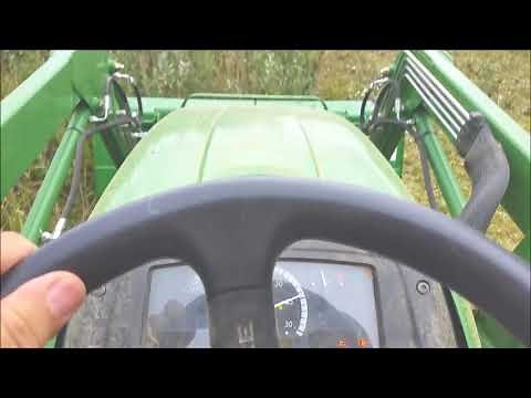 John Deere 3032e cutting steep hillsides