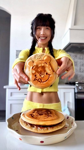 Elle 🐇 on Instagram: "Winnie the Pooh Dorayaki 🥞 aka Japanese pancake with sweet Anko Red Bean filling 🫘😋 Also did you ever watch Doraemon as a kid? 💙 Even if you didn’t you’ve probably seen Doraemon somewhere, he’s an adorable blue cat robot from the future with a red collar, yellow bell and pocket full of endless magic! And Dorayaki is his faaave food and “coincidentally” mine too growing up 🤣🥞 And even if you didn’t grow up with this, Dorayaki is truly the ultimate level up for your pa