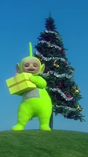 we're hiding the rest of the gifts in Tinky Winky's bag 🤭🎁 Video: Dipsy, the green Teletubby, holds and dances around with a present.