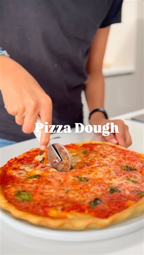 Nisha Parmar on Instagram: "AD 🍕 A classic pizza dough recipe that will become a staple in your home. Let Sai guide you with his foolproof method using the Magimix Food Pro. Makes 1 large pizza 200g strong white bread flour 100ml water 2 tbsp olive oil 4g salt 5g yeast Tomato Sauce 1 good quality tinned tomatoes (i use san marzano or mutti polpa) 1 tsp dried oregano 1 tsp extra virgin olive oil Sea salt flakes TOPPING 100g low moisture mozzarella cheese (or fior di latte) Fresh basil leaves TO 