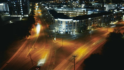 Timelapse of a crossroads in a city at night - Free Stock Video