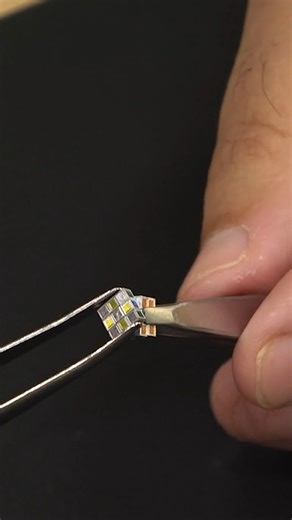 Smallest rotating puzzle cube - measures 4.90 mm (0.19 in) wide 4.92 mm (0.19 in) tall and 4.99 mm (0.19 in) long by MegaHouse Corporation 🇯🇵 | Guinness World Records