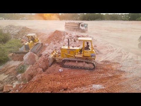 Great Largest Land Reclamation Technique Process Bulldozer Clearing Stone and DumpTruck Moving Stone