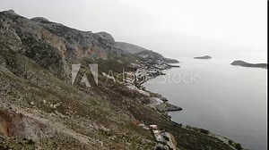 Aerial drone view of Kalymnos island with villages, coastline, and lots of climbing sectors behind, Greece. High quality 4k footage.