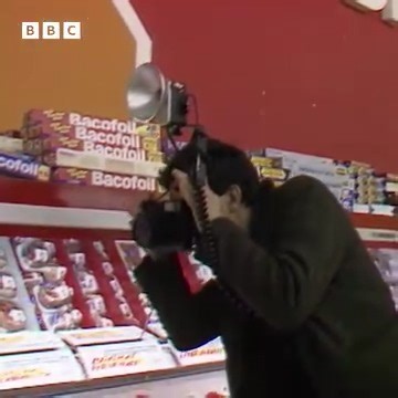 Martin Parr, British documentary photographer has died at the age of 73. Parr became famous throughout his lifetime for his iconic brightly coloured photographs of British life which elevated the mundane into works of art and created a unique social history. In 1986 he took part in a project to document and archive life in Salford, and he spoke to the BBC about why capturing images in supermarkets and shops was as important as any other kind of photography. Clip taken from Saturday Review, origi