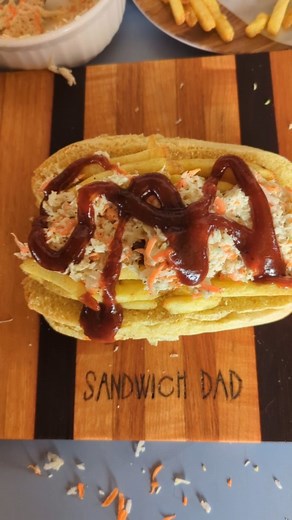 The Polish Boy - first time trying this iconic Cleveland sandwich. Polish sausage, fries, coleslaw, and Sweet Baby Rays. Also, sporting my new favourite t-shirt from @sandwichesofhistory #polishboy #sandwich #cleaveland #isahotdogasandwich #sandwichgram #sandwichesofinstagram #sandwichdad #sandwichesofhistory | The Sandwich Dad
