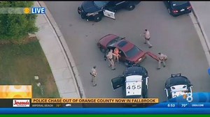 A high-speed chase that originated in Los Angeles County ends in a Fallbrook neighborhood, as CHP officers approach the car with guns drawn. http://kfmb.us/bCPBj | CBS 8 San Diego