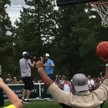 Aaron Rodgers throwing a pass to a fan on a boat!