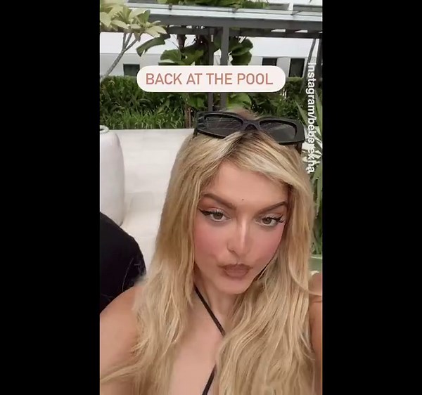 Bebe Rexha enjoys her time at the hotel pool in Singapore before her show