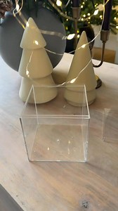 Elevate your Christmas decor game with this DIY idea! ✨ Fill acrylic boxes with festive knick-knacks and twinkly lights for a classy, modern touch. Perfect for tablescapes or shelf styling! 🎄✨ #DIYChristmasDecor #ClassyChristmas #HolidayStyle | Start at Home