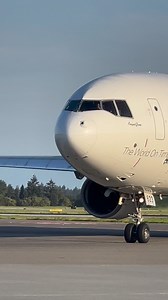 FedEx Express MD-11F prepares for takeoff from SeaTac's runway 34R, destination Oakland, with the golden hour light showering down. | Planeclicker_