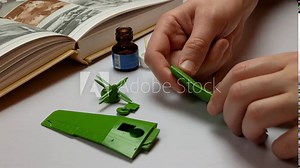 Hobbyist is assembling an plastic model of airplane, Bonding parts of airplane model kit together Stock Video