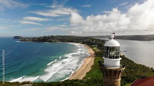 Palm beach lighthouse drone view, stunning aerial close up of Palm Beach, Australia with its panoramic coastline, crystal-clear waters, and iconic lighthouse. Discover this coastal paradise in 4k