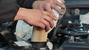 Replacing The Fuel Filter Of A Diesel Car Close-up.