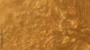 Liquid gold boiling abstract background. Golden sand flowing in water, metallic yellow texture