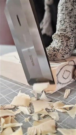 Carving small wood blocks into detailed shapes using sharp chisels creative woodworking techniques