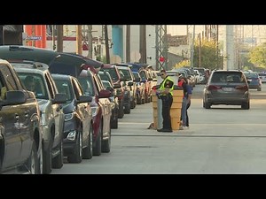 Drive-thru food distribution at the Bexar County Food Bank Saturday