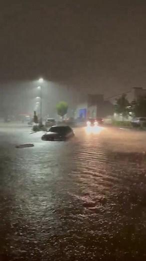 The hurricane floods the North Bergen Walmart parking lot. | HudPost