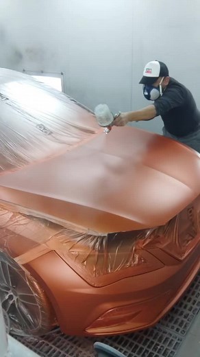 Mastering Car Painting Techniques in a Professional Booth